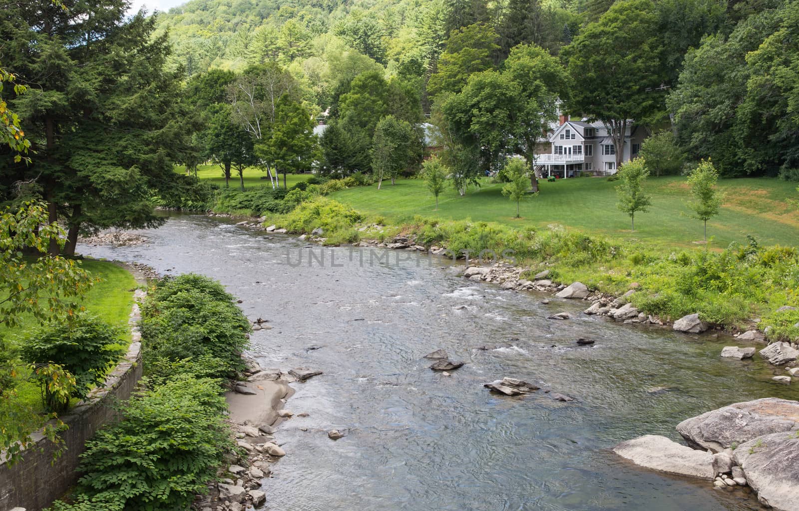 This Vermont river, the Ottauquechee, flows right through the middle of the small town of Woodstock.