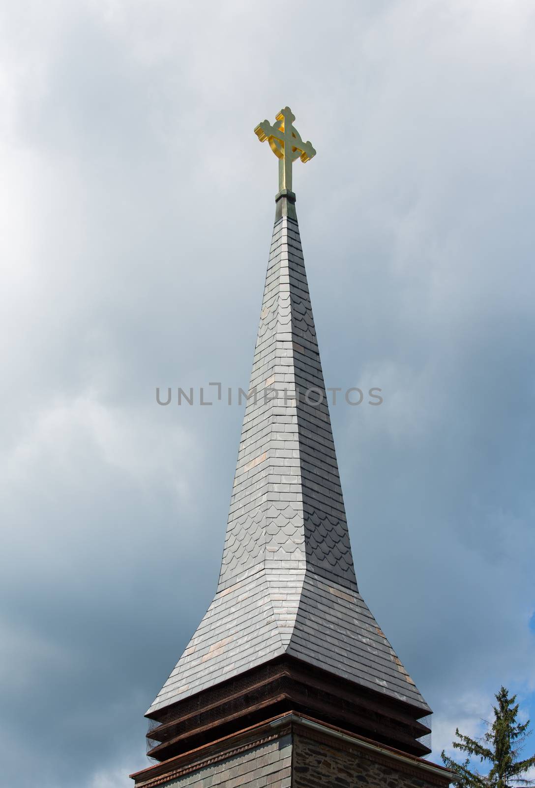 This Celtic Cross is lifted high to the heavens on a tall church steeple. The ring in the cross respresents eternity.