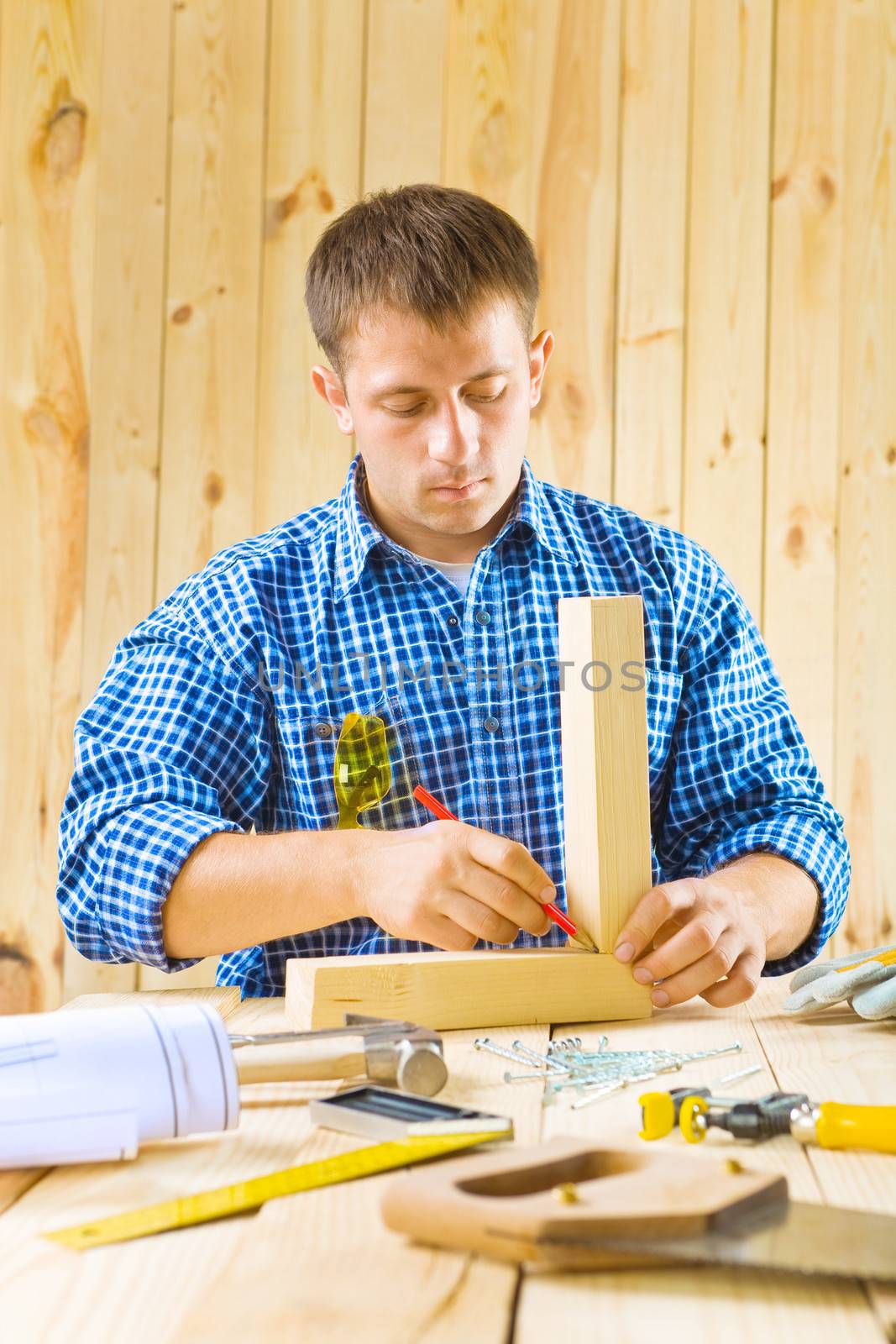 carpenter does works with pencil