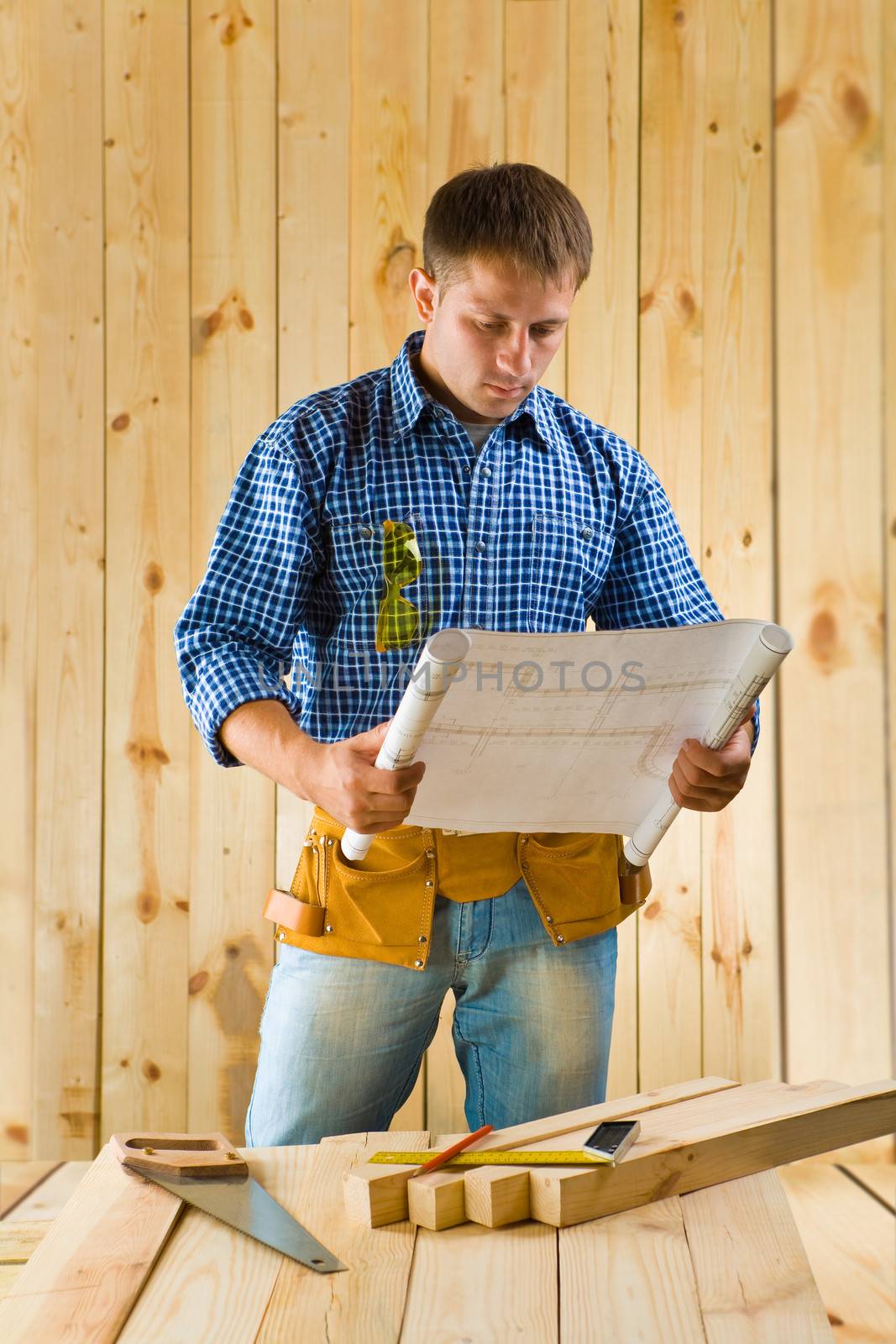 carpenter with blueprint by mihalec