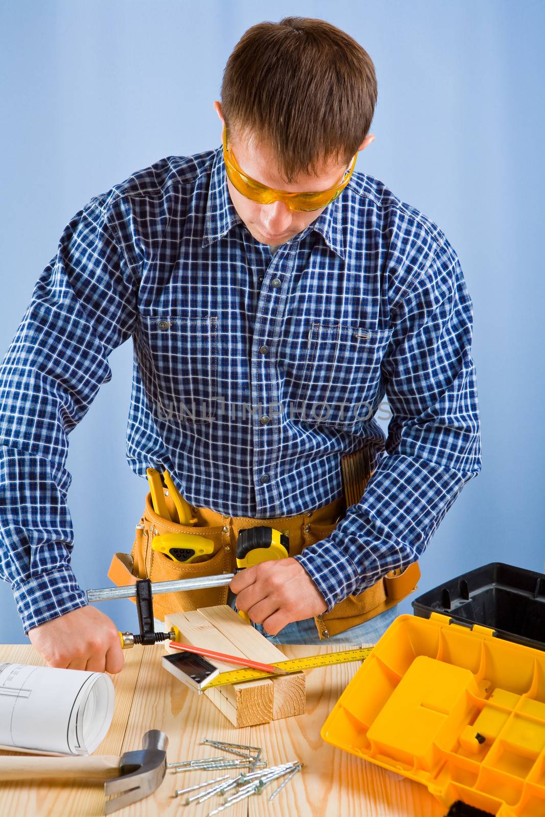 carpenter works with carpenter vise