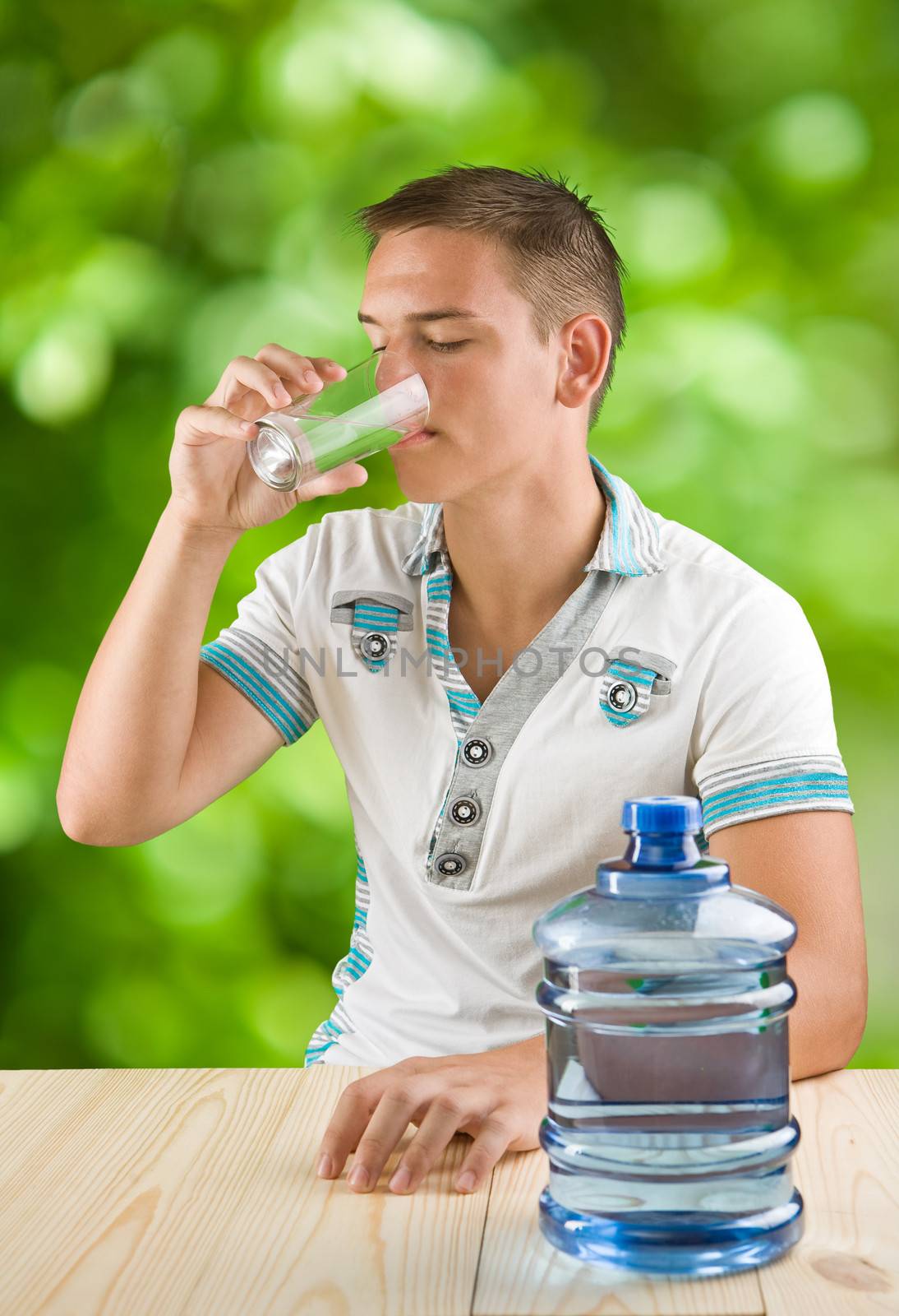 guy drinking water by mihalec