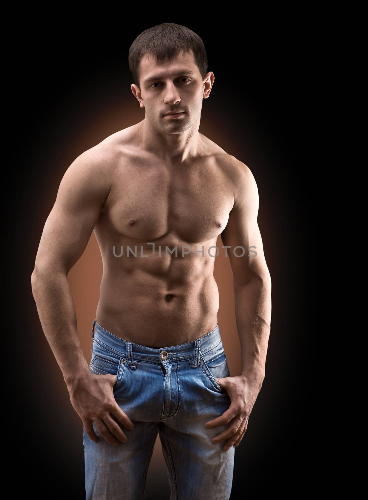 muscular men in blue jeans