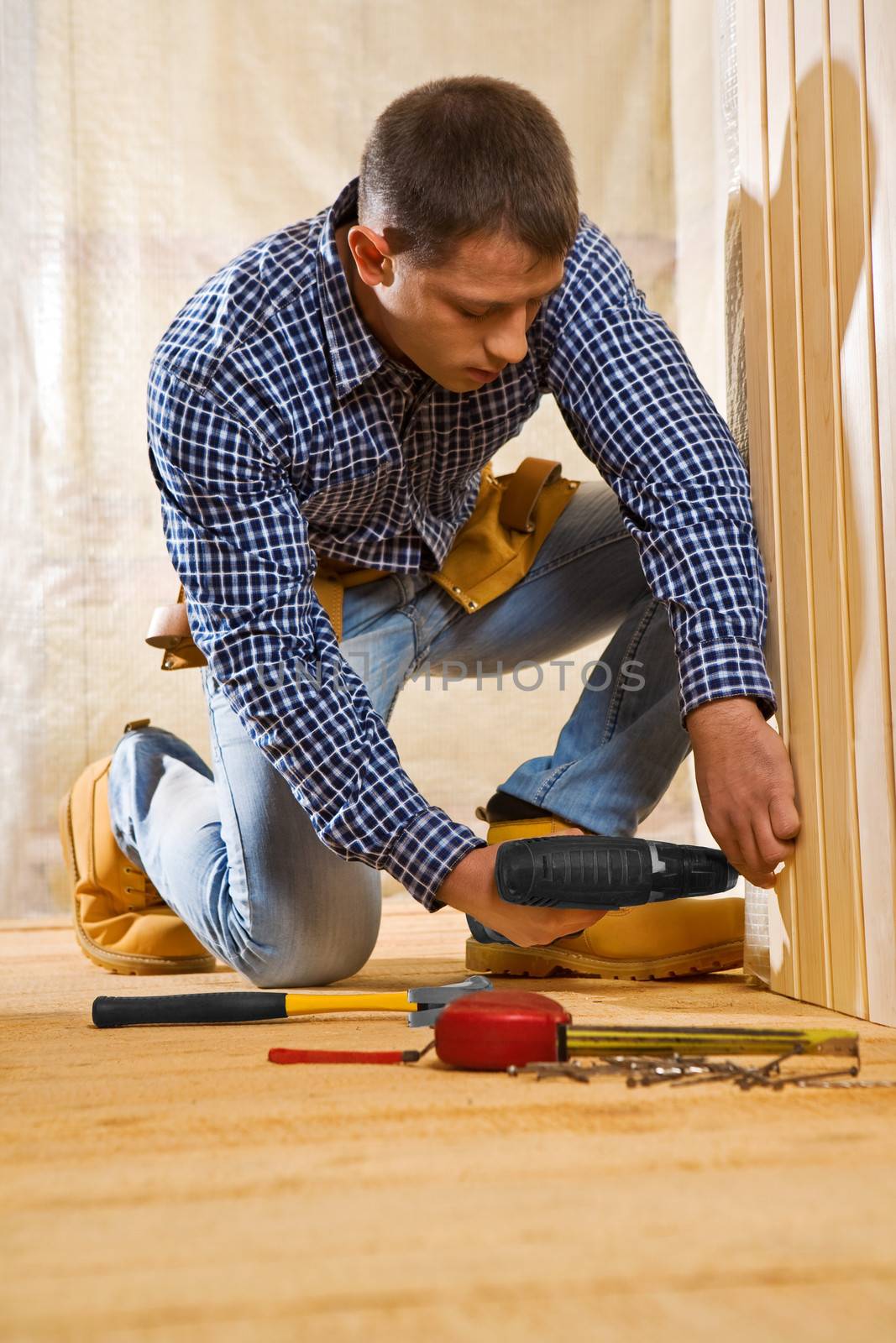 single man work in the wooden room by mihalec