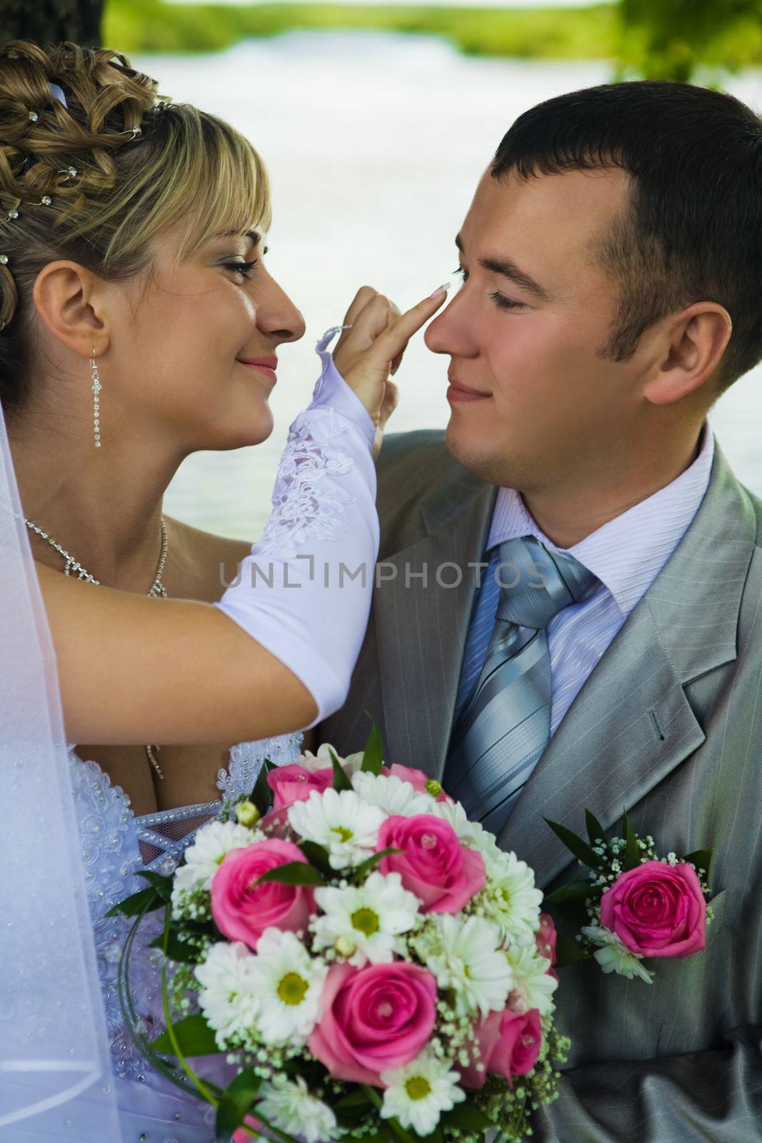 The bride looks after the groom by mihalec