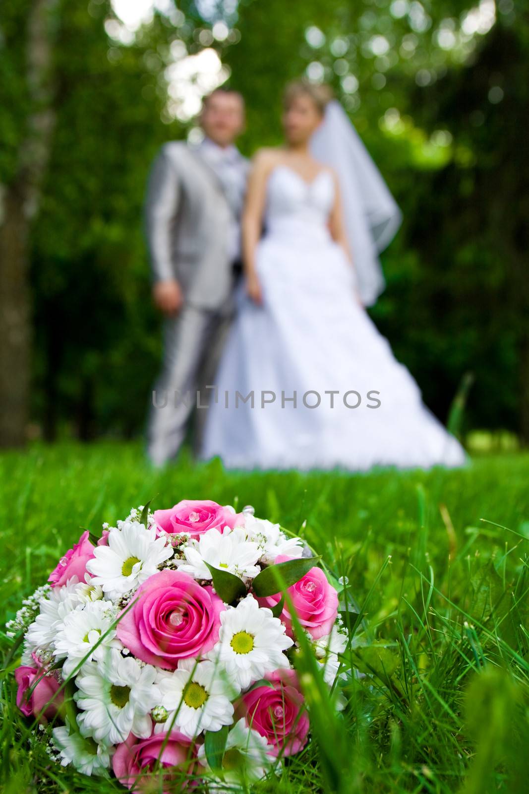 weding bouquet on a grass by mihalec