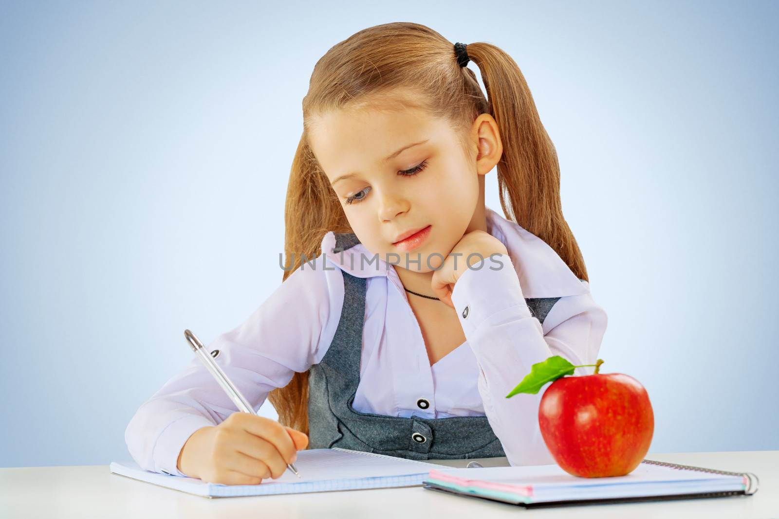 a litli schoolgirl writing