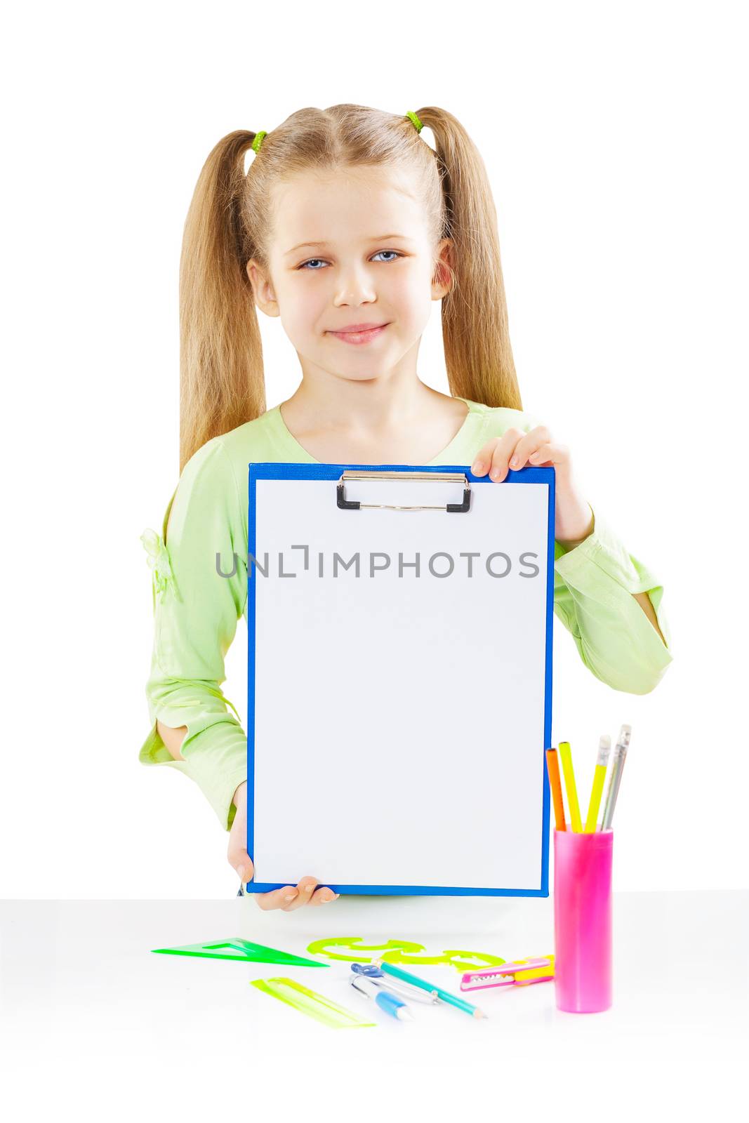 a schoolgirl holding paperclip near table