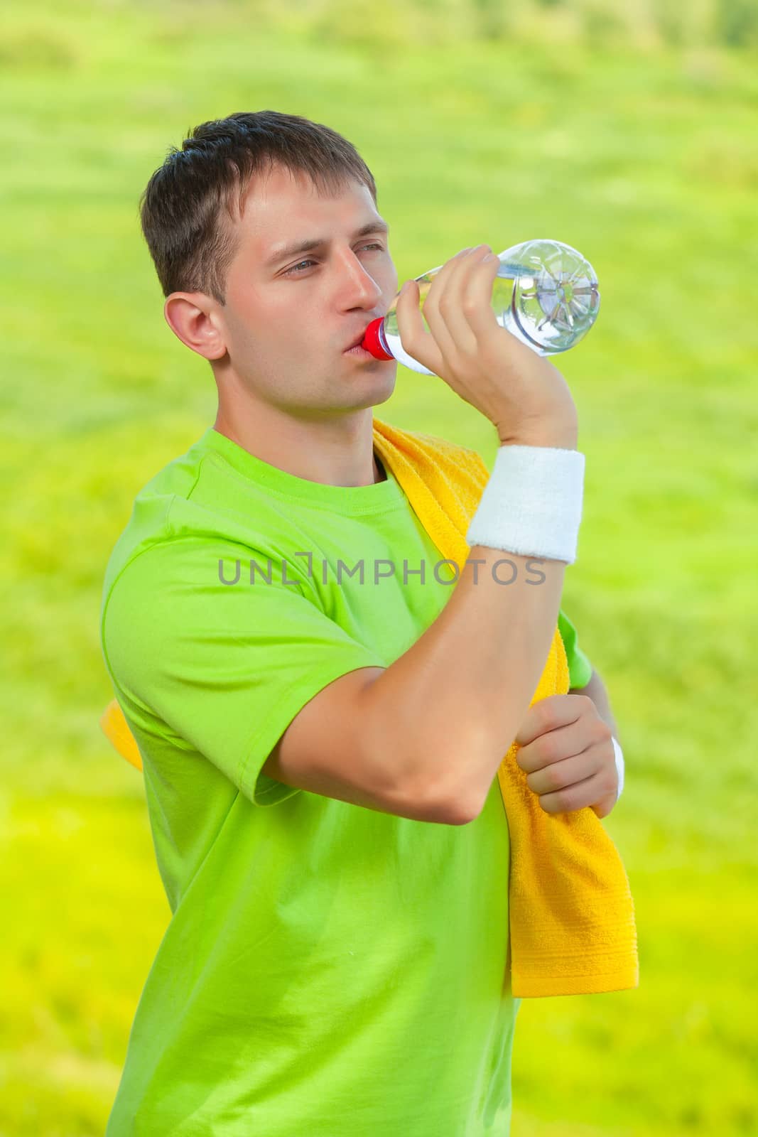 a sportsman drinking water by mihalec