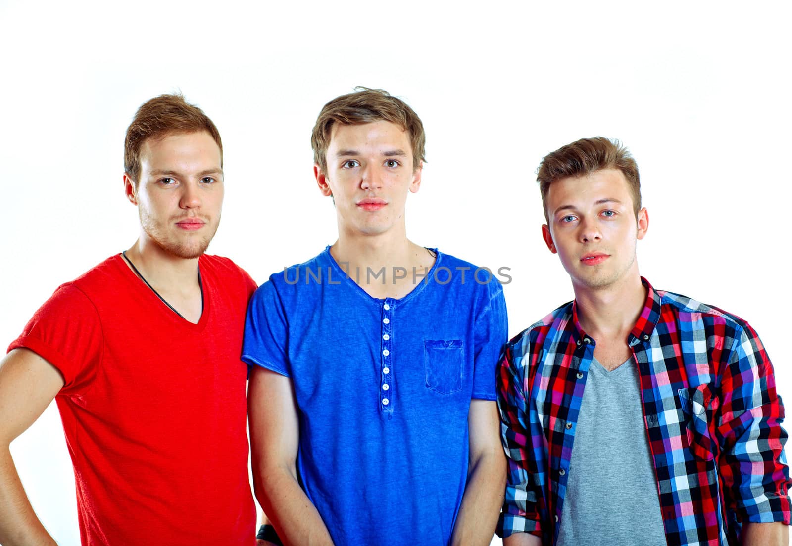 Portrait of three young happy teenagers grimacing. Isolated on white background.