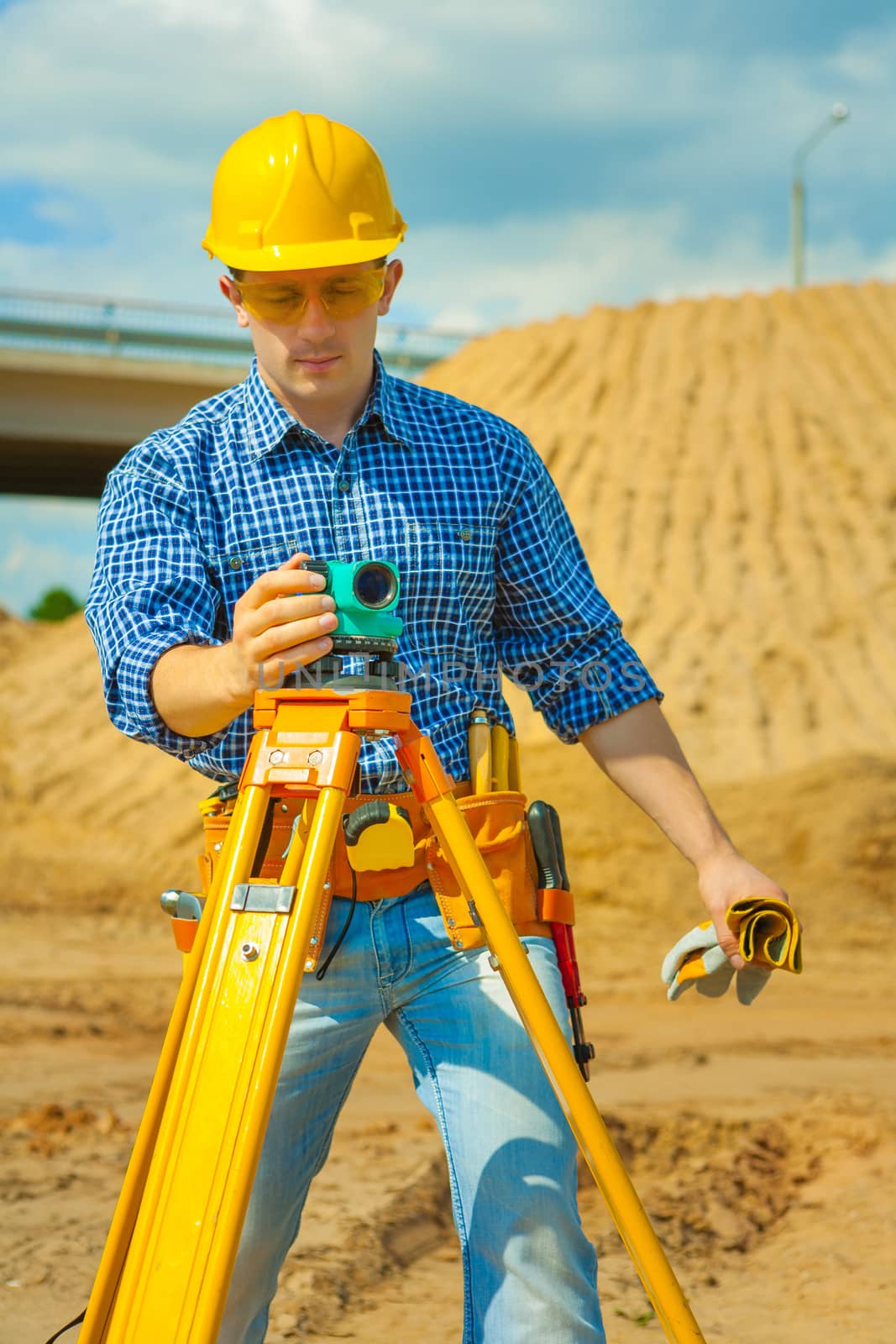 a worker with theodolite