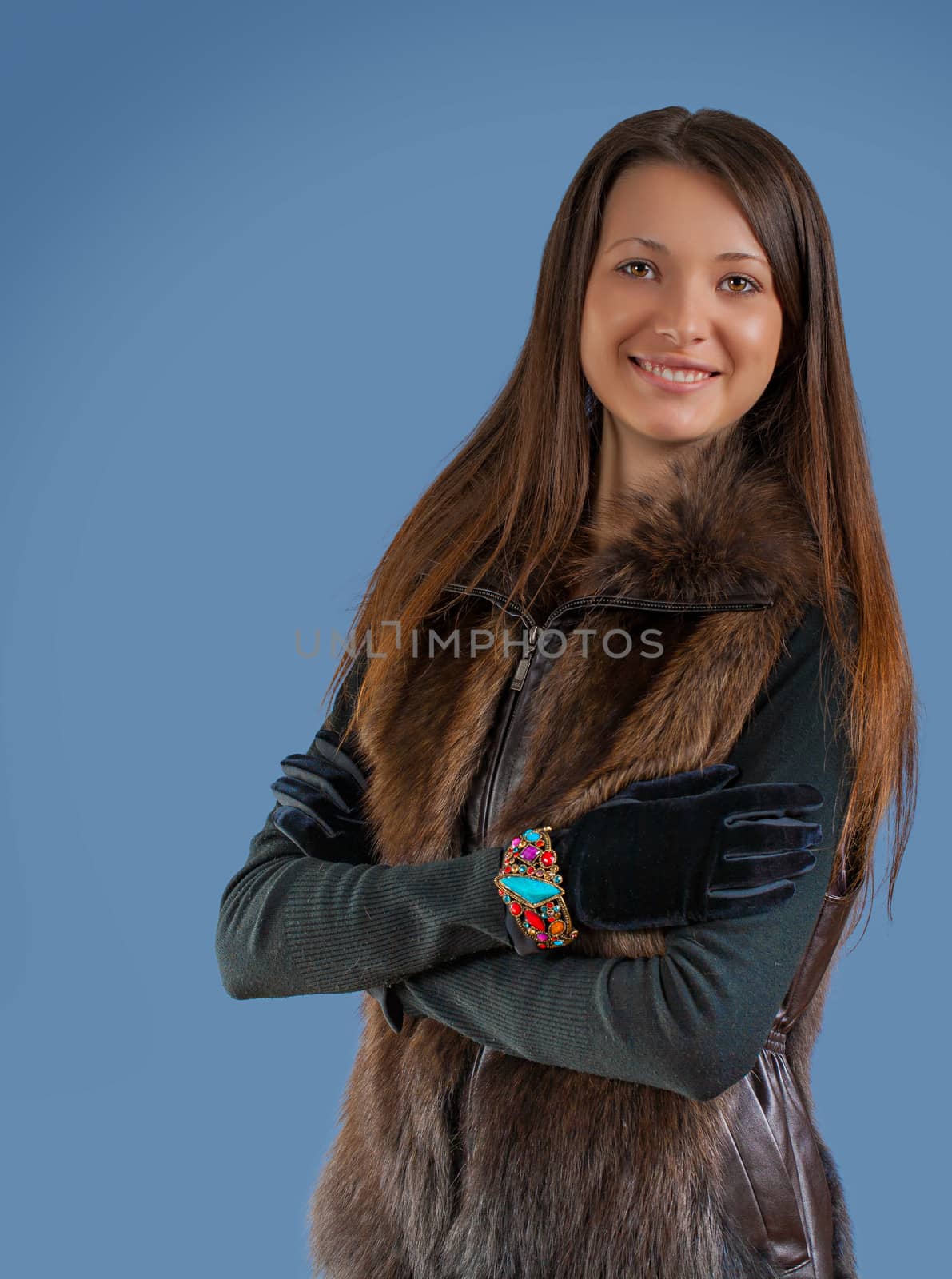 a young beautyful brunette on blue background by mihalec