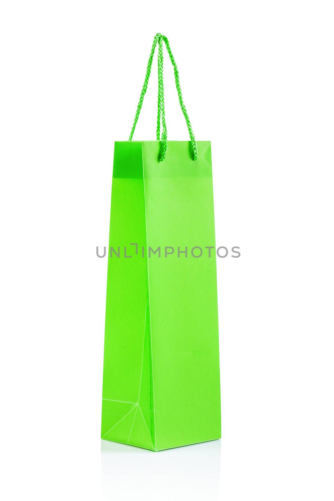 a single green paper bag isolated by mihalec