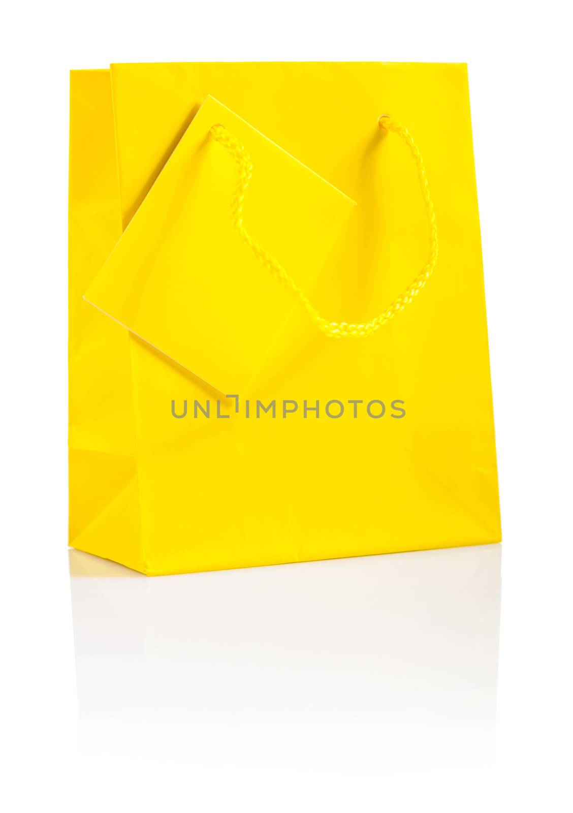 a yellow paper  bag isolated by mihalec