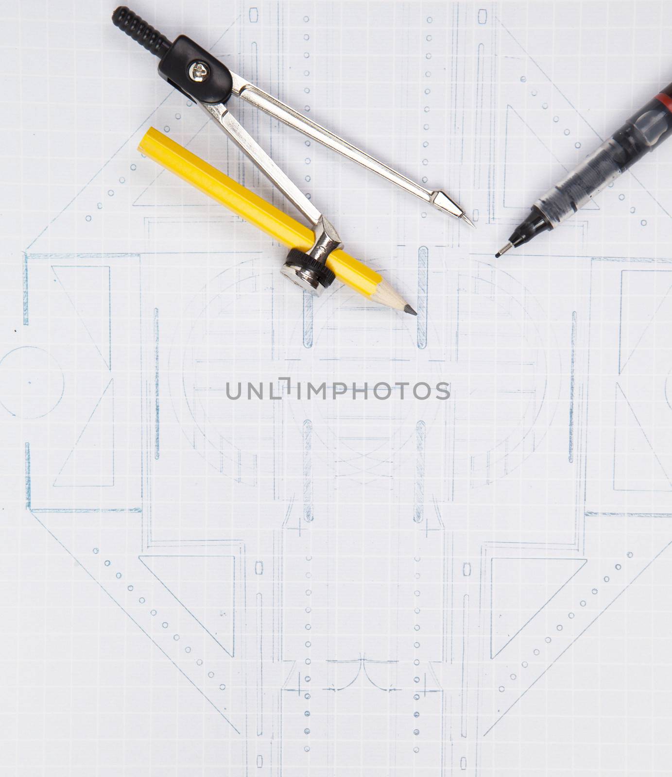 compass and writing pen on architect plan by khunaspix