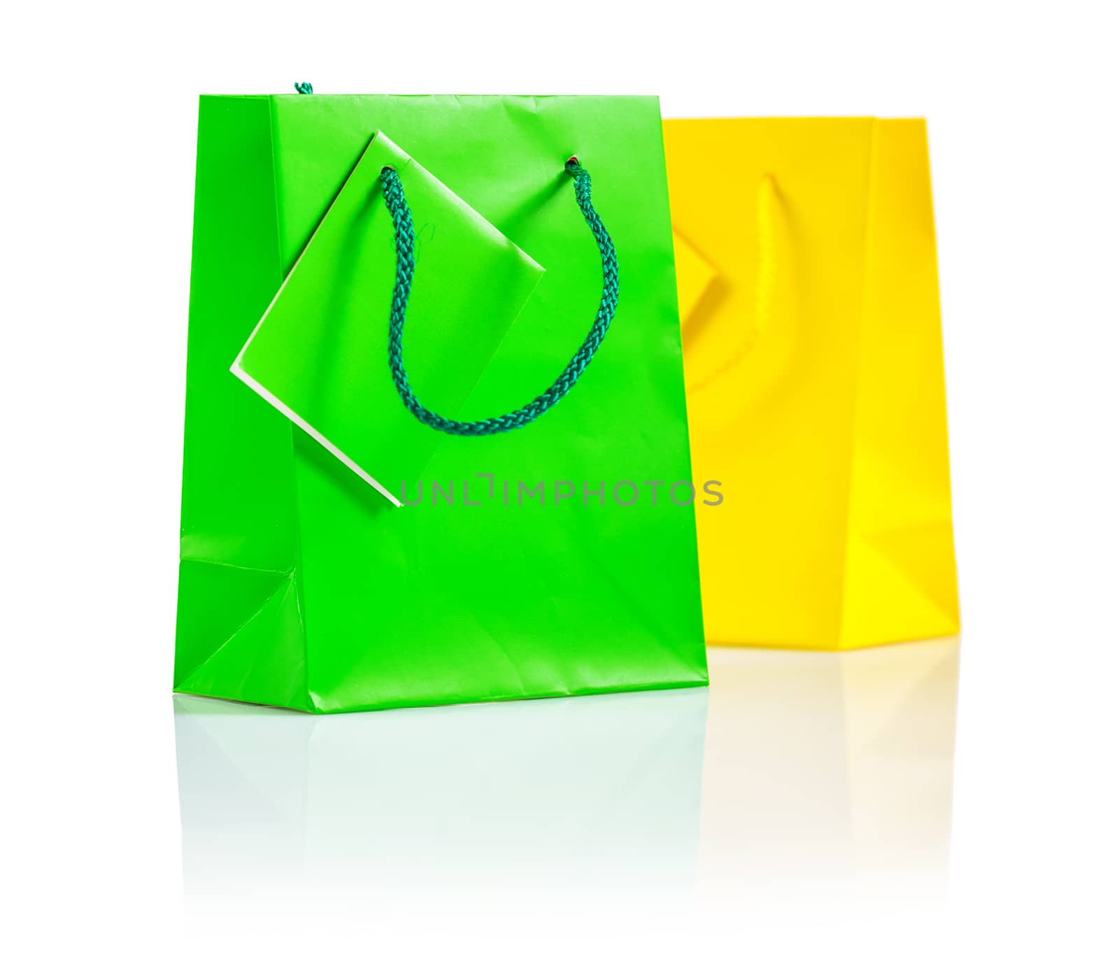 green and yellow paper bags isolated