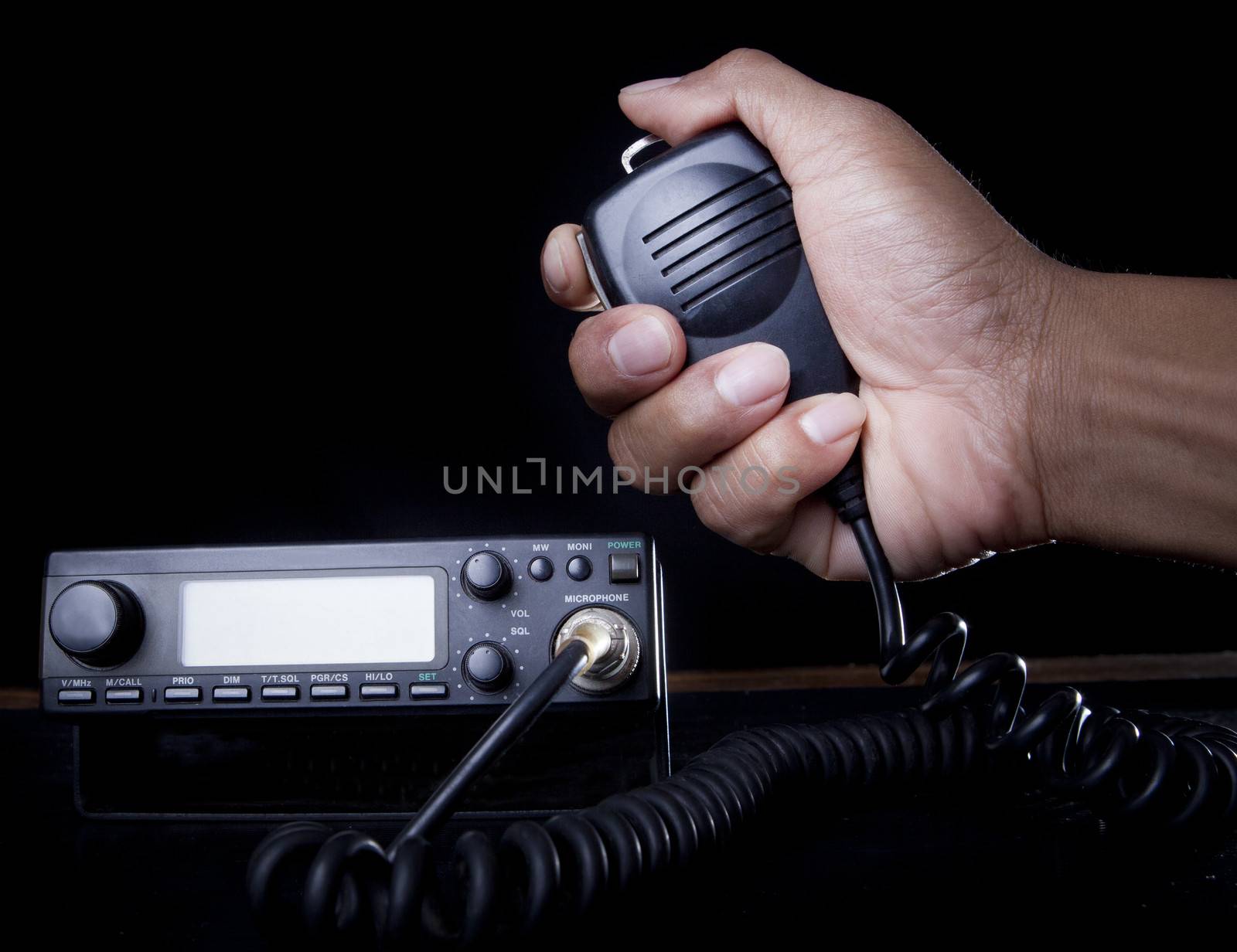hand of Amateur radio holding speaker and press for radio communication theme