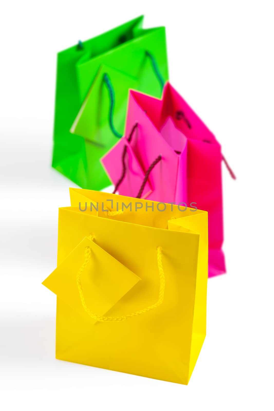 three colored isolated paper bags