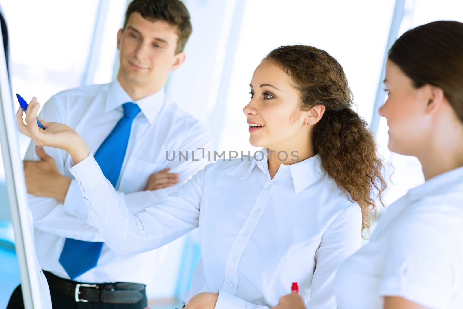 businessmen are meeting near the flipchart by adam121