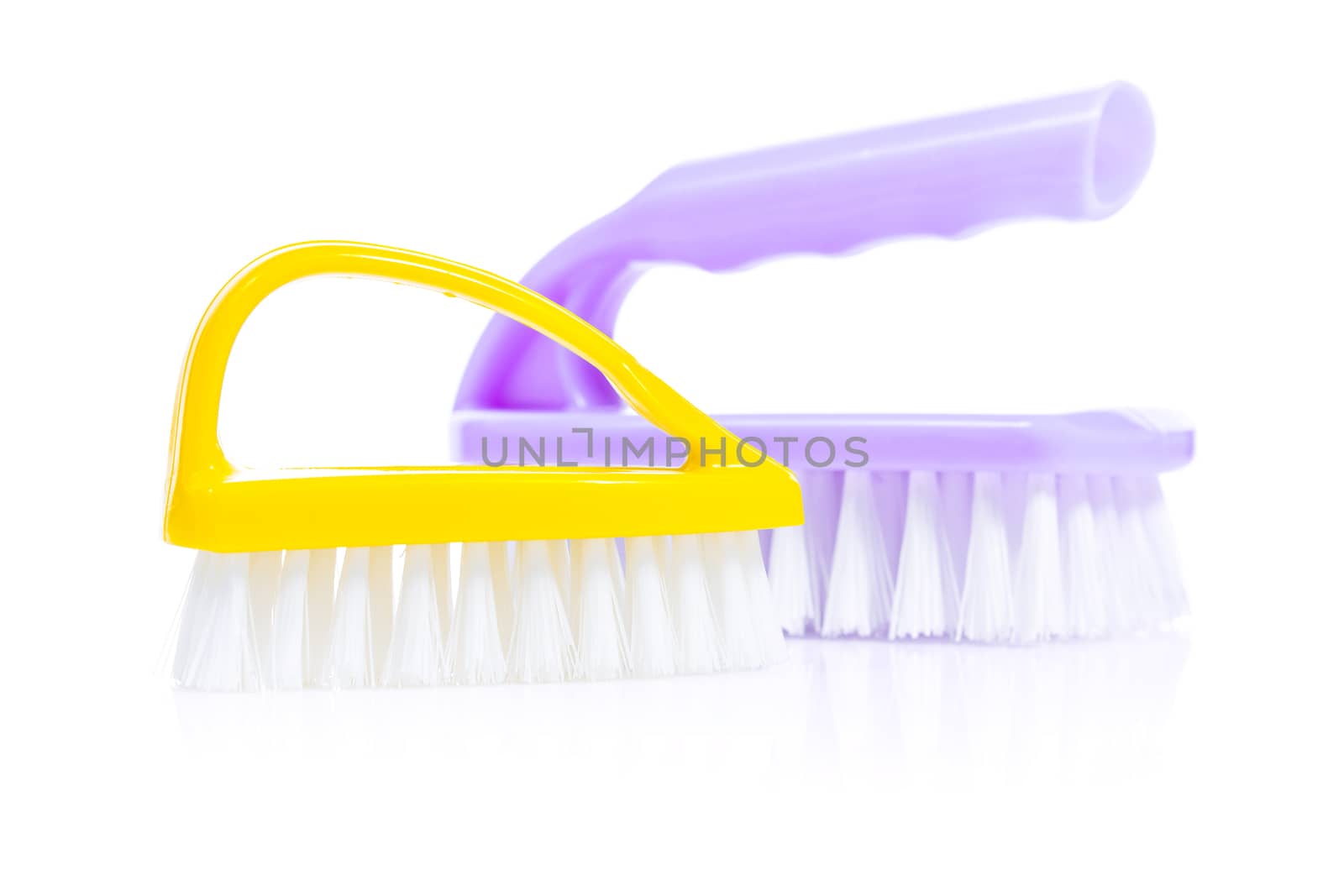 yellow and purple kitchen brushes