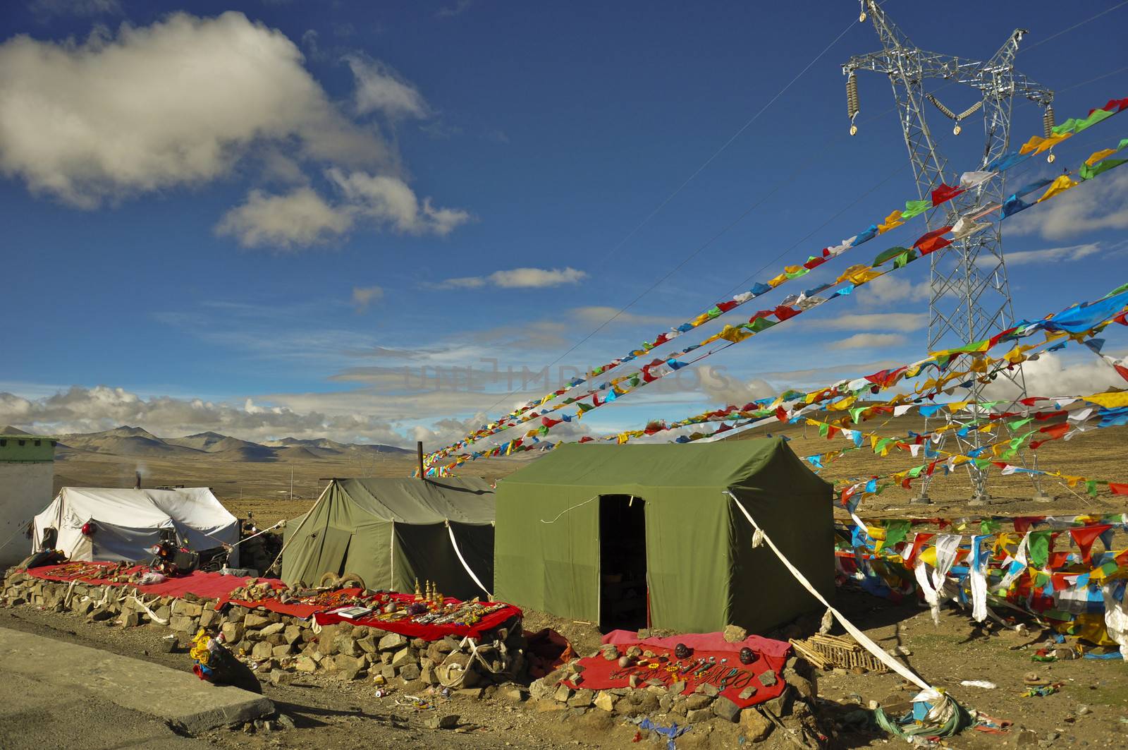 there are tents set up along the road in the mountain in tibet in china