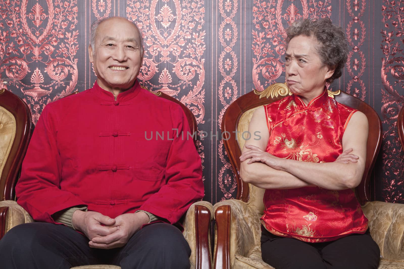 Angry Grandmother and Happy Grandfather in Traditional Chinese Clothing