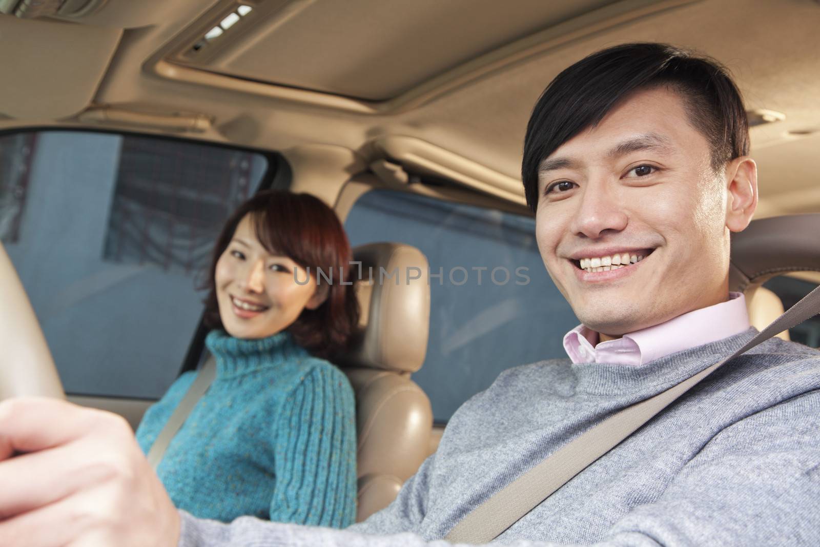 Couple sitting in car, Beijing 