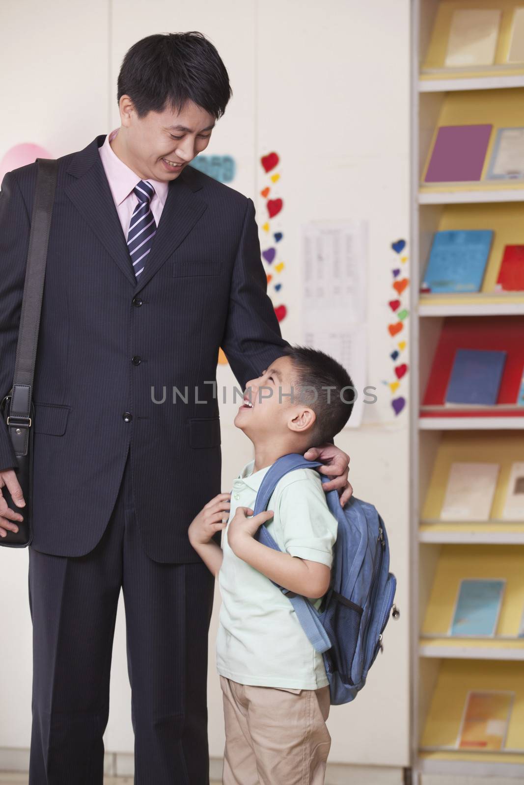 Father And Son In School Classroom
