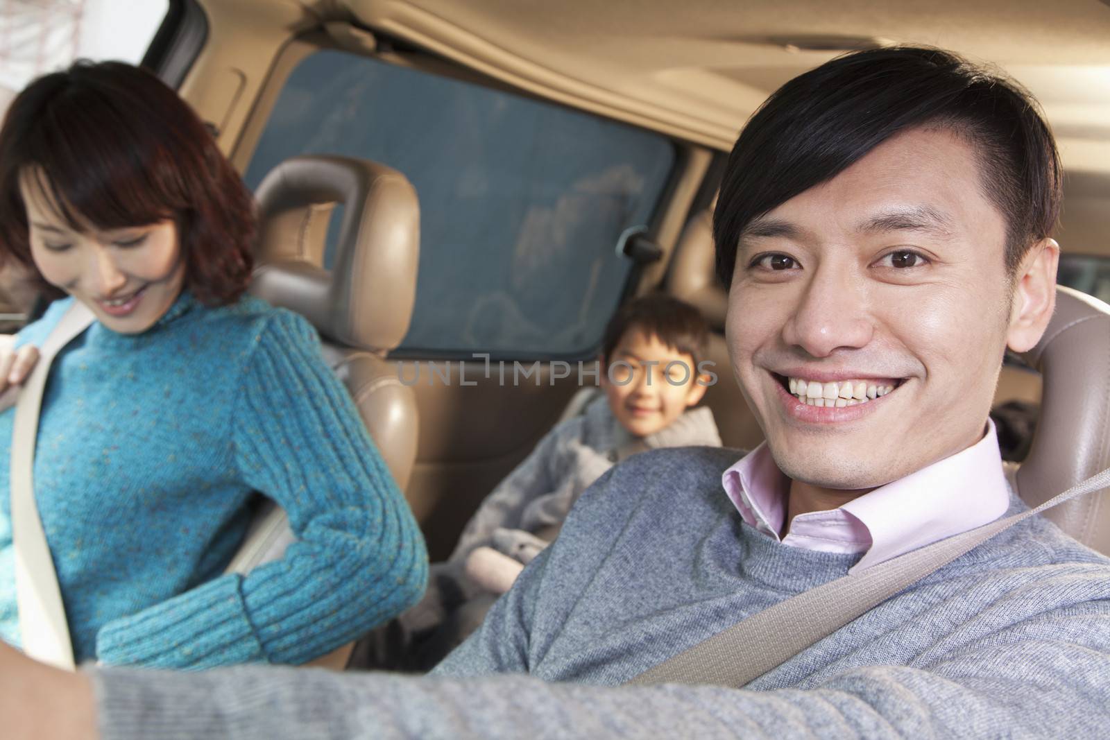 Family sitting in car, Beijing 