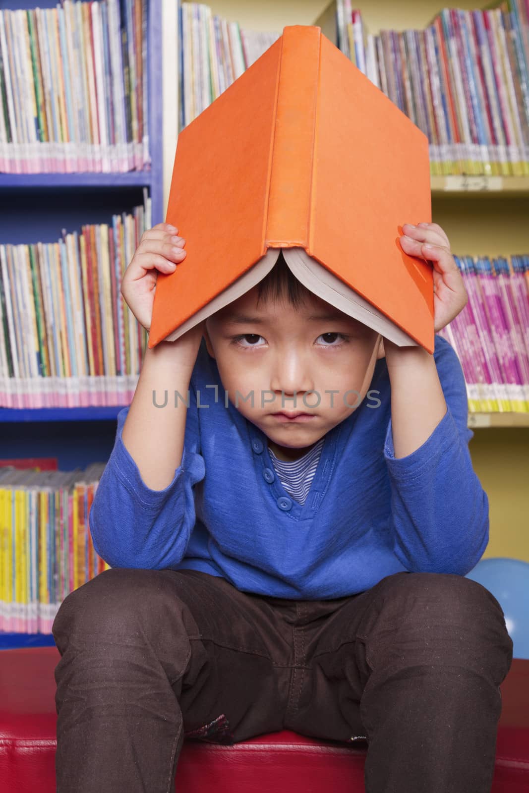 Unhappy Boy with Book
