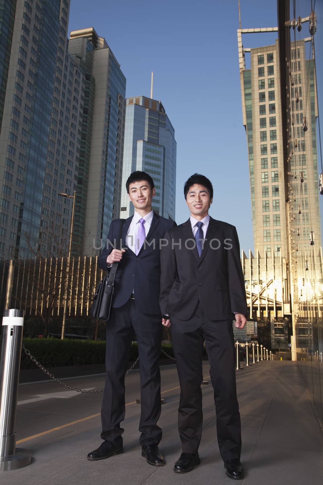 Businesspeople in Business District by XiXinXing