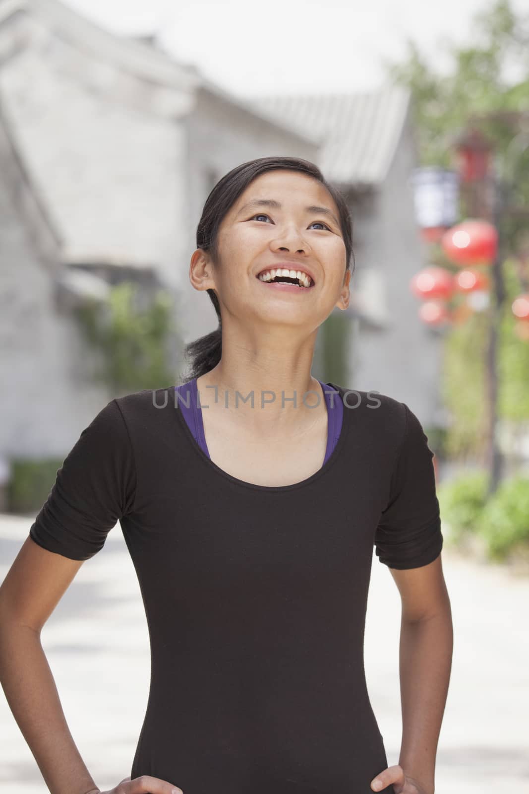 Young Woman smiling and looking Away