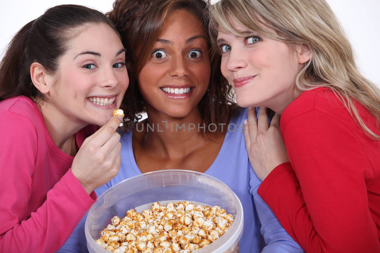 Peppy women eating popcorn