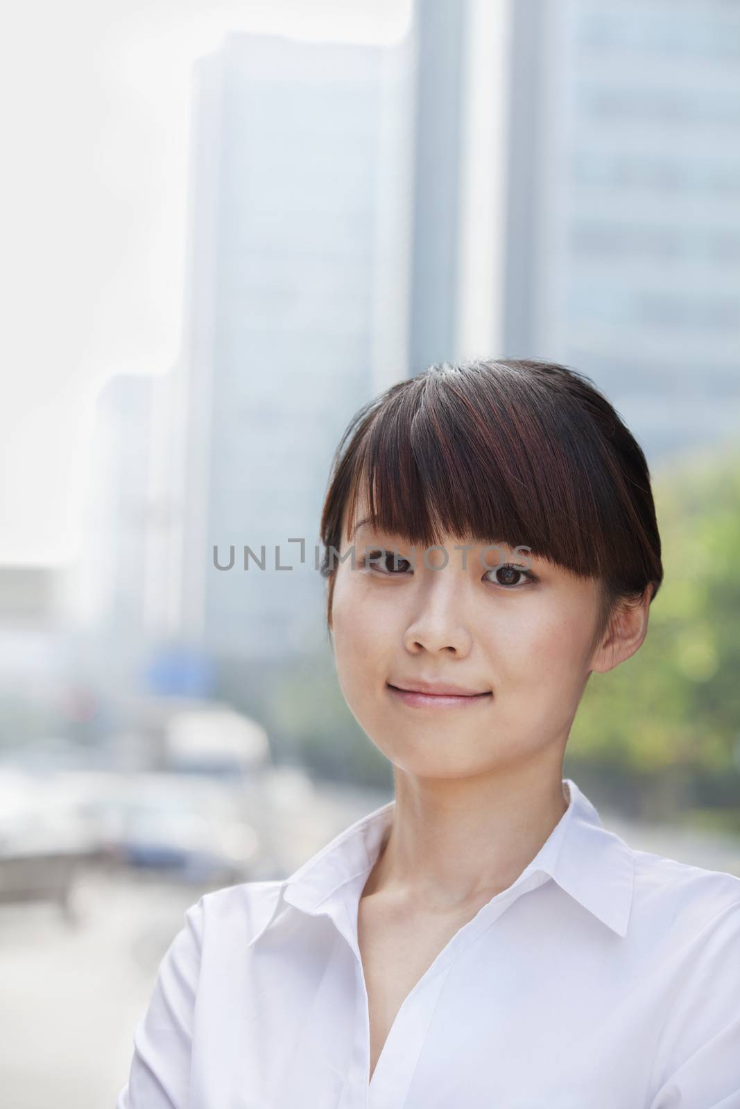 Portrait of young businesswoman smiling, Beijing