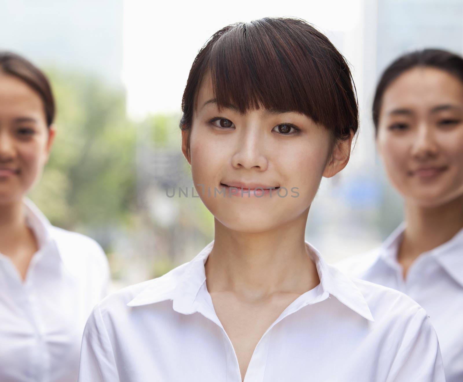 Portrait of young Businesswoman smiling in Beijing by XiXinXing