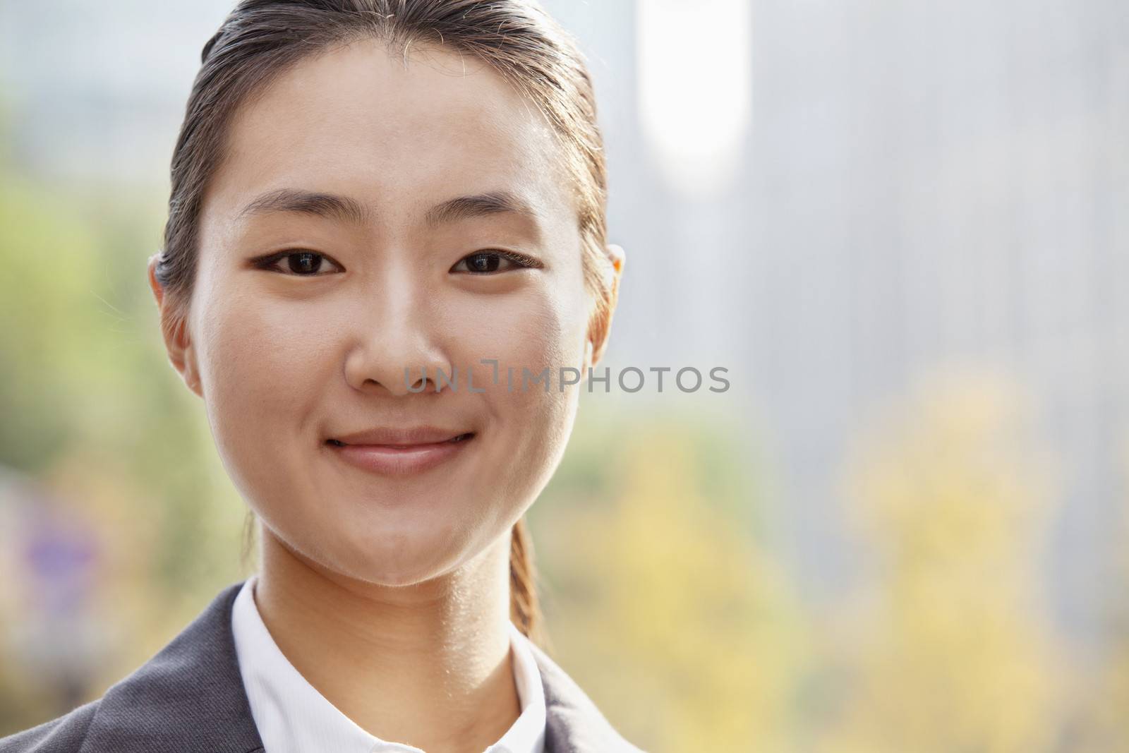 Portrait of young businesswoman smiling outside in Beijing 