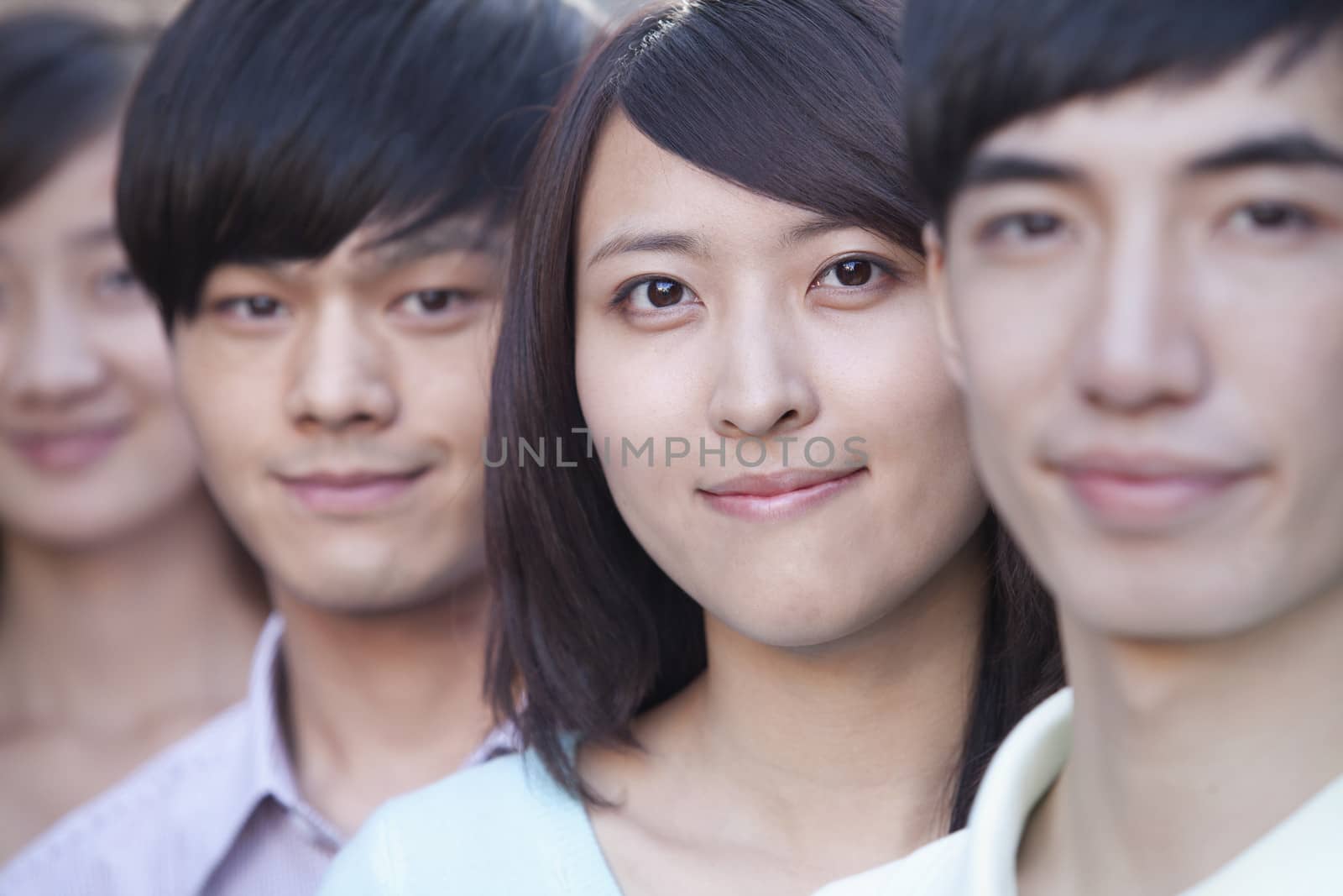 Close Up of Four Young People Standing in a Row in Beijing by XiXinXing