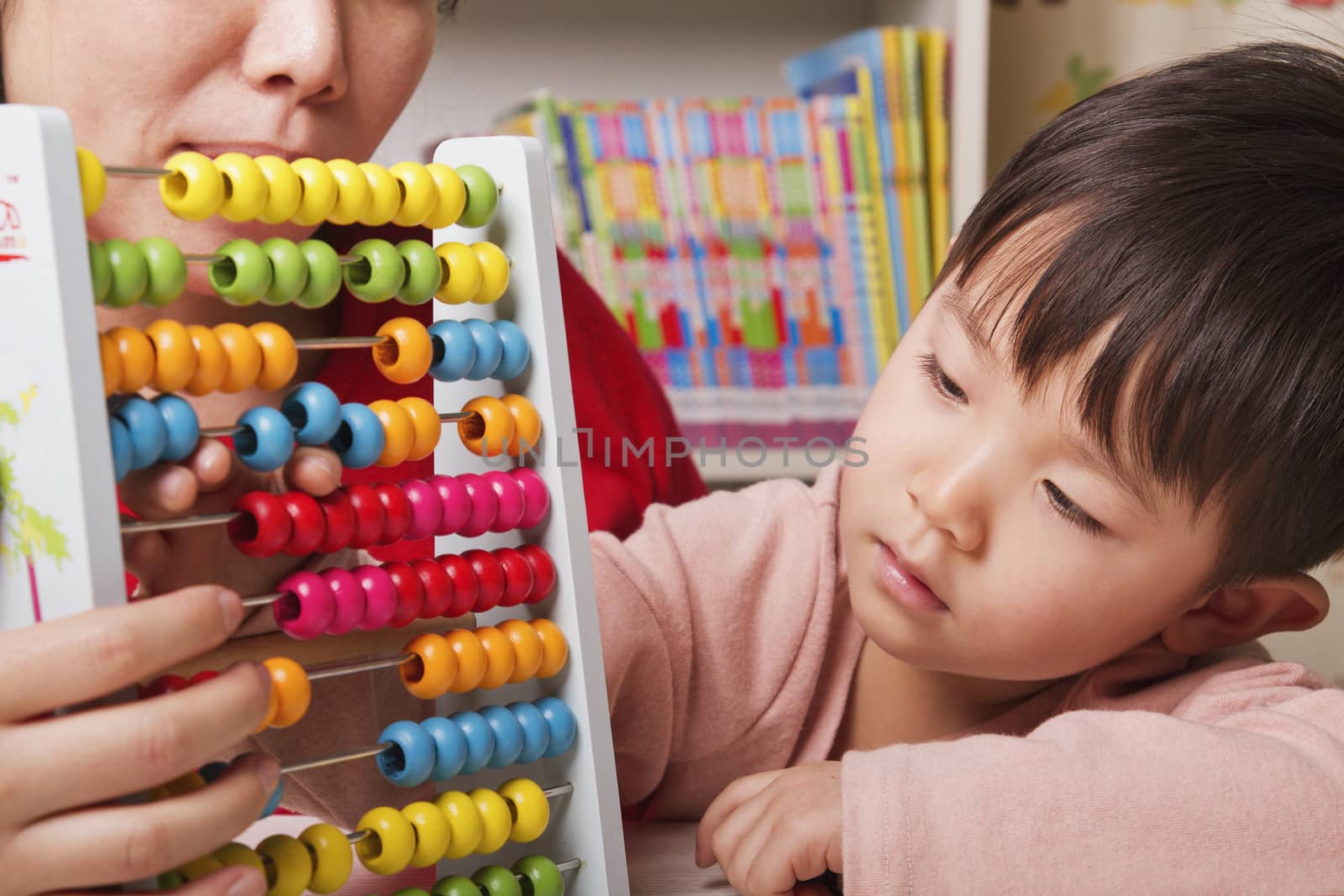 Boy Playing with Abacus