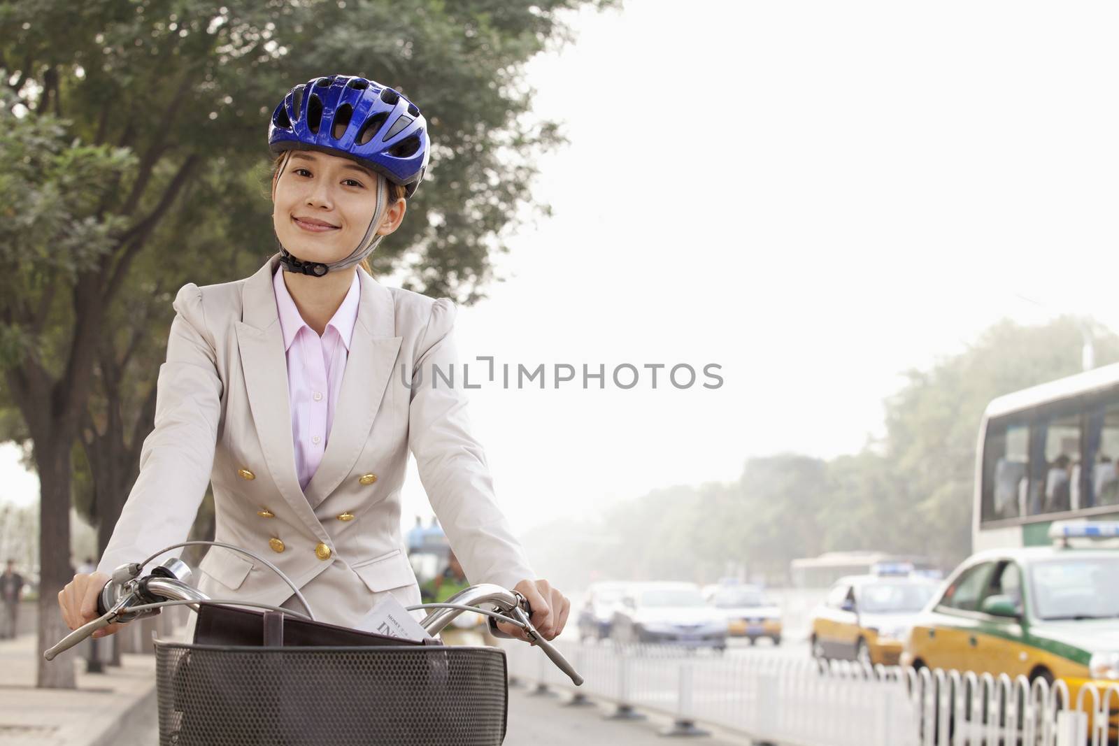 Young Business Woman commuting with a Bicycle, Beijing, China