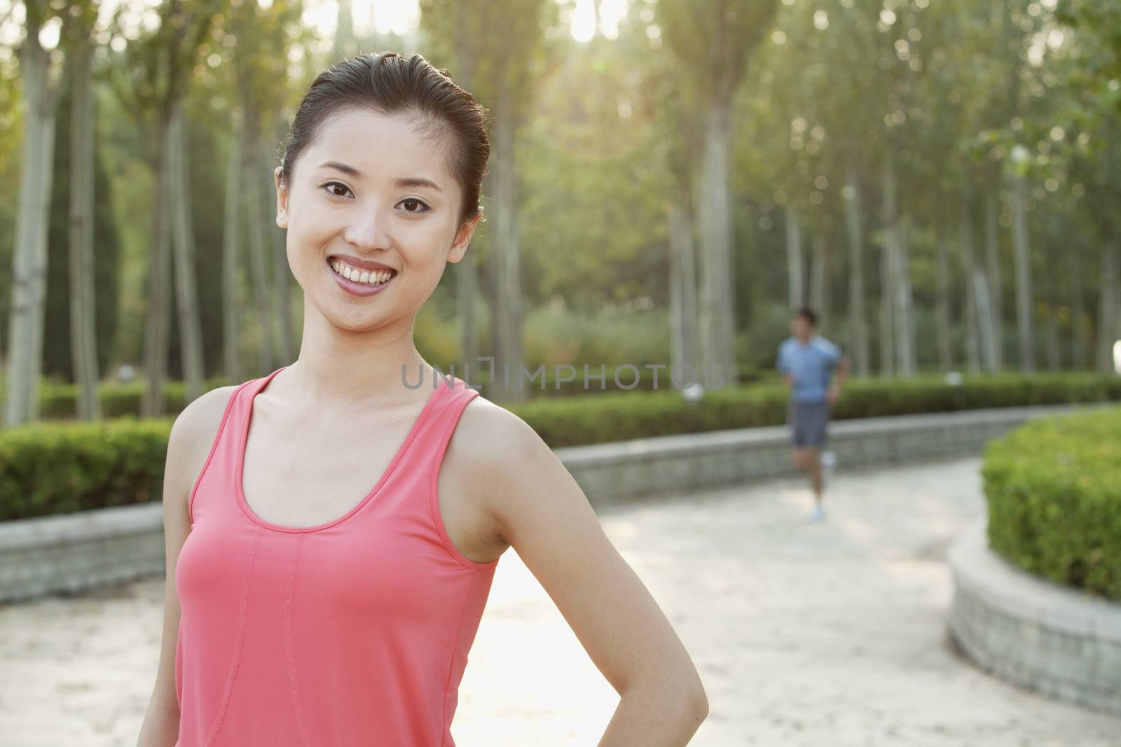 Young Woman in exercise clothing in a Park, Beijing, China by XiXinXing