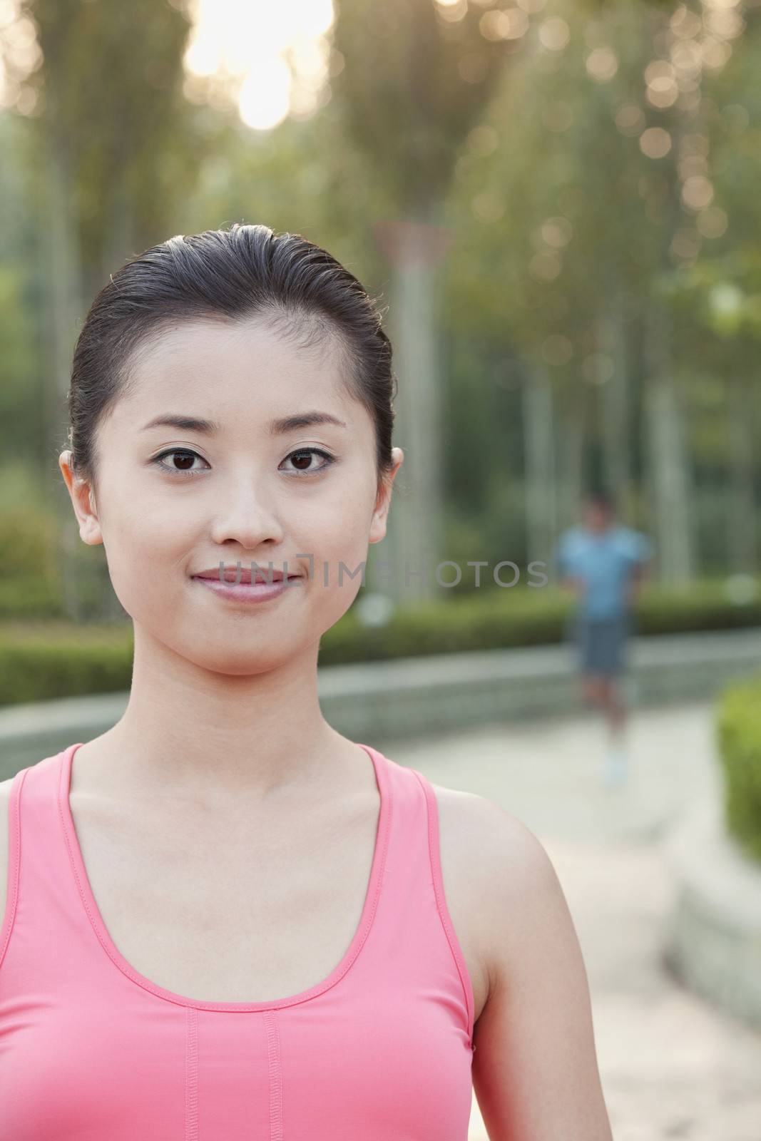Young Woman in exercise clothing in a Park, Beijing, China by XiXinXing