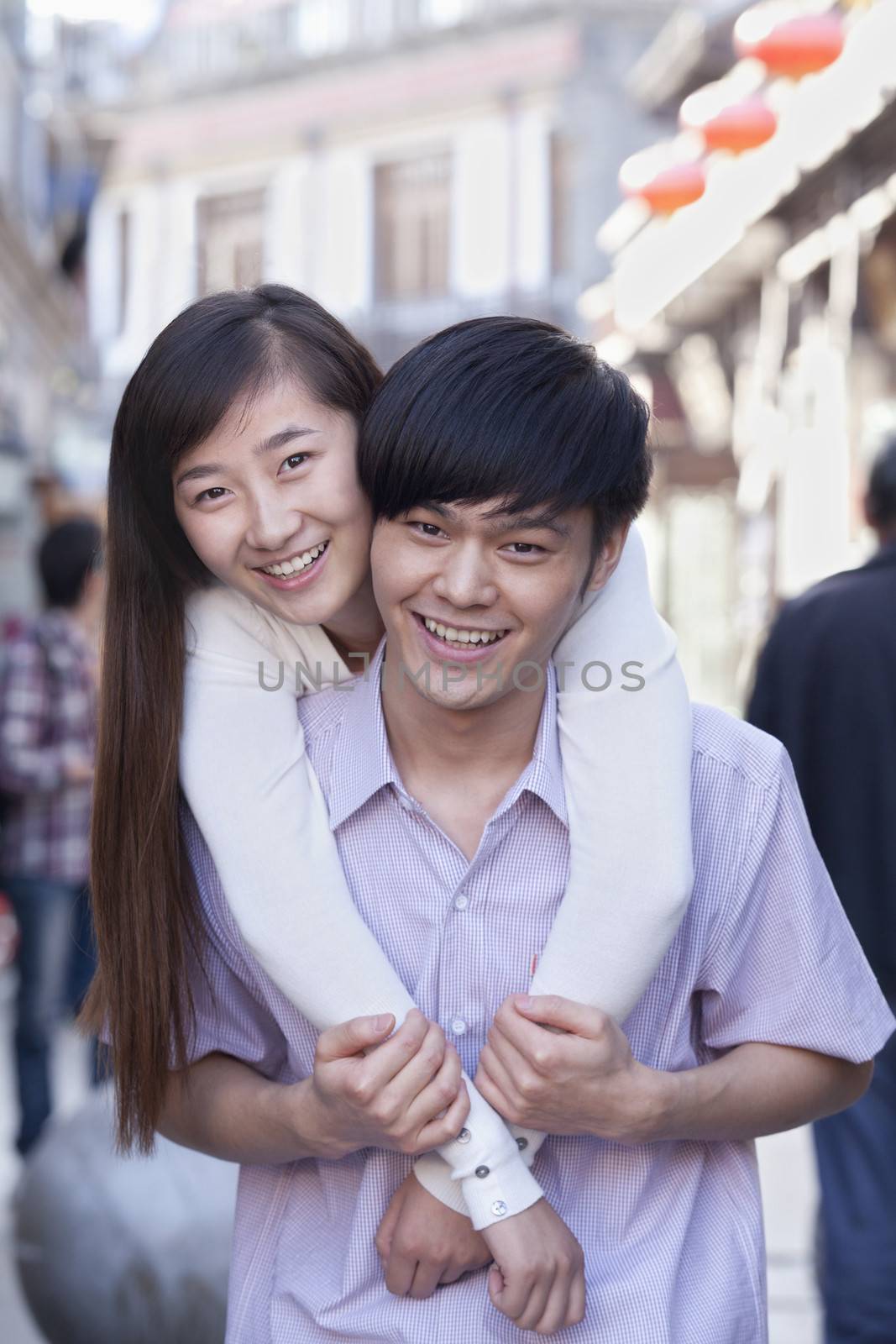 Portrait of Young Heterosexual Couple Embracing Outdoors in Beijing by XiXinXing