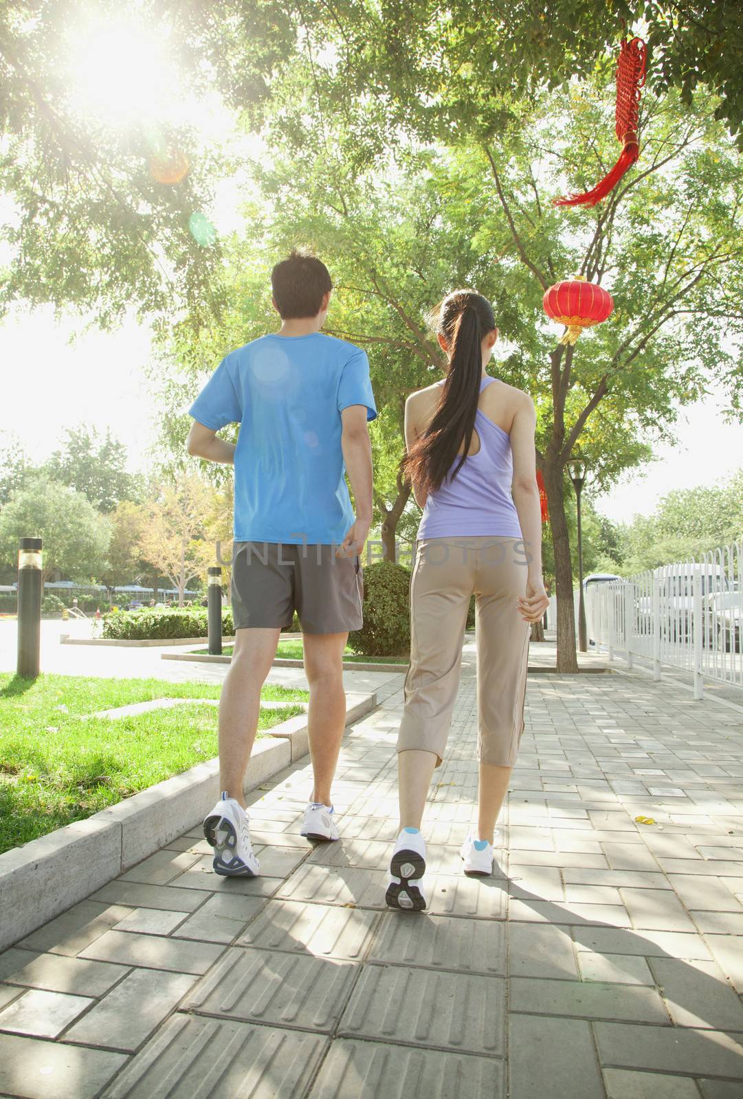 Young Couple Walking Together by XiXinXing