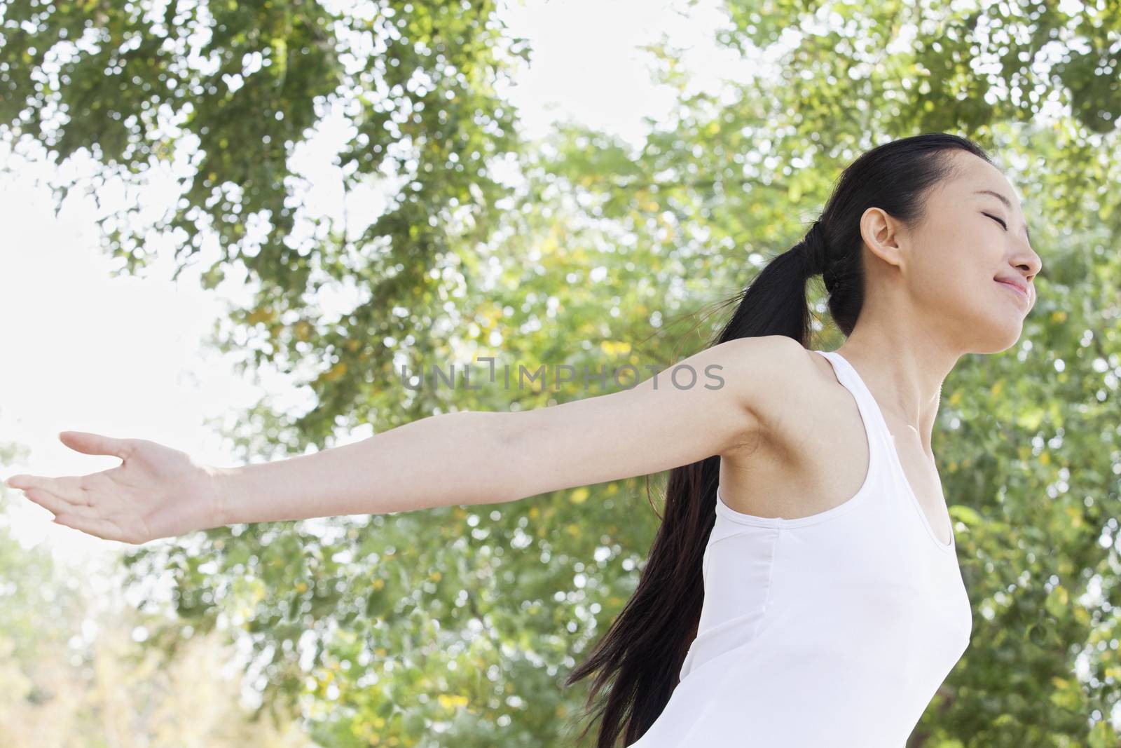 Relaxed Young Woman in Park