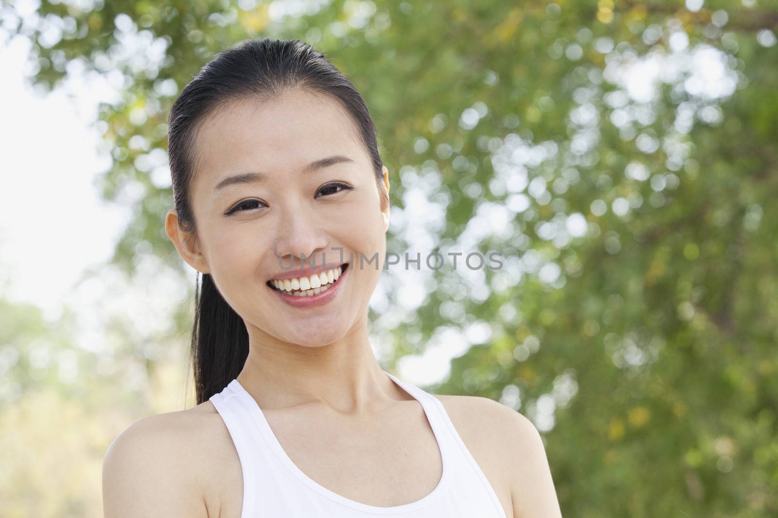 Young Woman Smiling  in Park