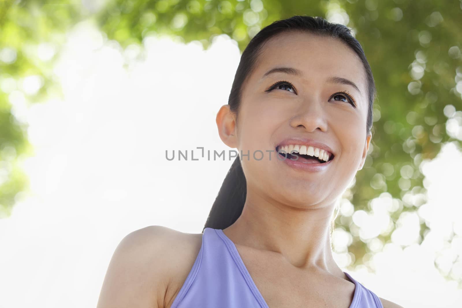 Portrait of Young Woman In Park