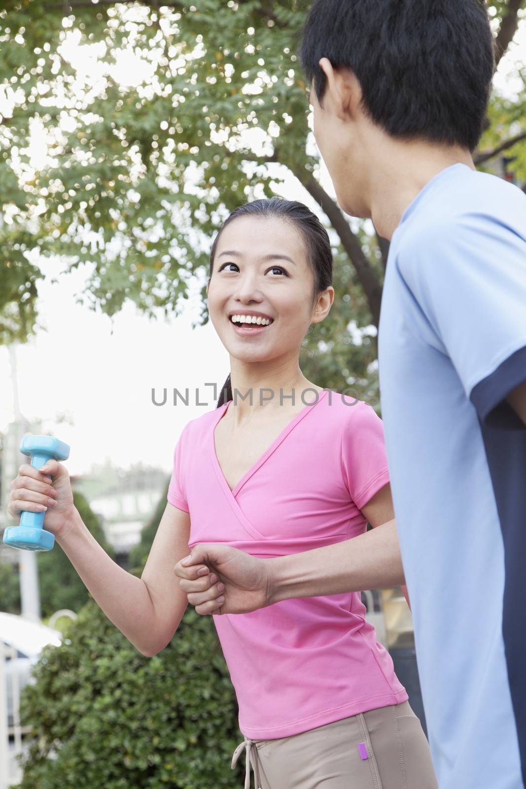 Young Couple Jogging In Park