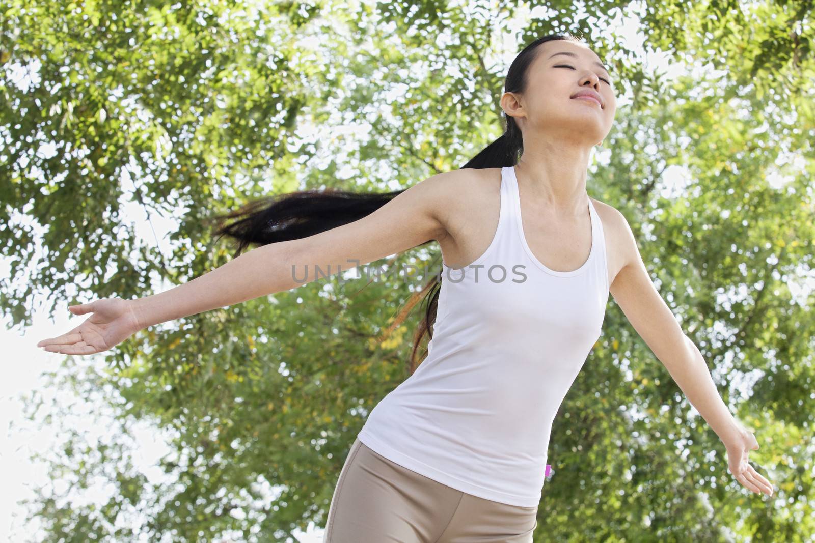 Relaxed Young Woman in Park