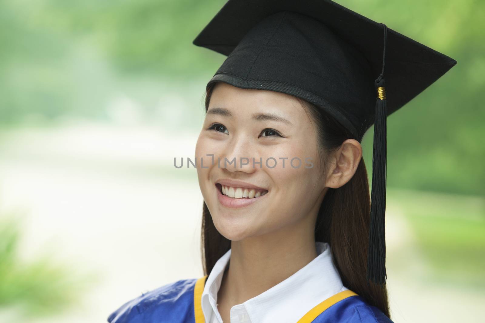 Young Woman Graduating From University, Close-Up Vertical Portrait