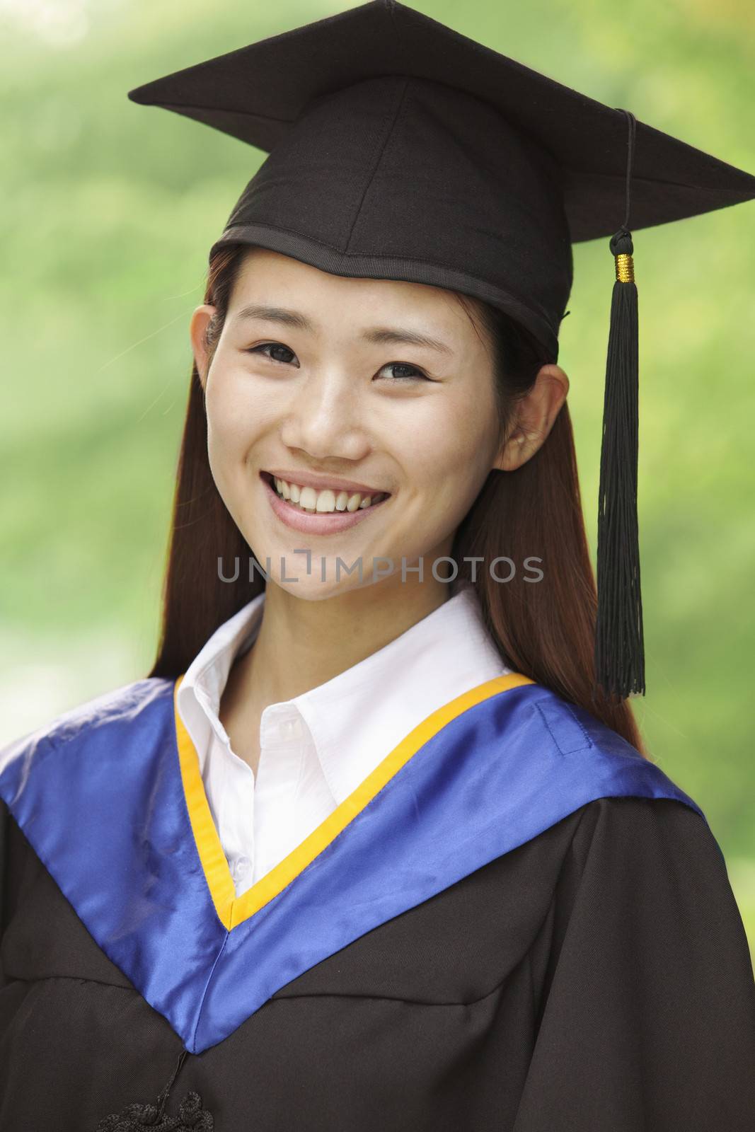 Young Woman Graduating From University, Close-Up Vertical Portrait by XiXinXing